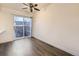 Cozy dining area with wood floors, and a sliding glass door to the fenced-in backyard at 1922 S Oswego Way, Aurora, CO 80014