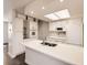 Kitchen with white cabinets and stainless steel appliances featuring bright, natural light at 1922 S Oswego Way, Aurora, CO 80014