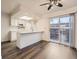 Bright kitchen with white cabinets, a peninsula counter, and stainless steel appliances at 1922 S Oswego Way, Aurora, CO 80014