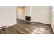 Bright living room featuring modern flooring and fireplace, bathed in natural light at 1922 S Oswego Way, Aurora, CO 80014