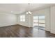 Dining area with gray vinyl plank flooring and sliding door access to patio at 27500 E Cedar Pl, Aurora, CO 80018