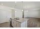 Modern kitchen with white cabinets, granite countertops and island at 27500 E Cedar Pl, Aurora, CO 80018