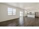 Open living room and kitchen area with gray vinyl plank flooring at 27500 E Cedar Pl, Aurora, CO 80018