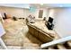 Carpeted basement featuring a large sectional sofa and television, perfect for relaxation at 2650 S Vaughn Way # B, Aurora, CO 80014