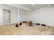 Spacious basement featuring carpet, workout equipment, and ample room for activities at 2650 S Vaughn Way # B, Aurora, CO 80014