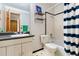 Bathroom featuring a vanity, a tub, and shower with blue and white accents at 2650 S Vaughn Way # B, Aurora, CO 80014