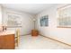 Bright bedroom with carpet, chair, desk, and windows at 2650 S Vaughn Way # B, Aurora, CO 80014