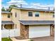 Charming townhouse features stone accents, a two-car garage, and well-maintained siding at 2650 S Vaughn Way # B, Aurora, CO 80014