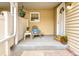 Welcoming front porch with decorative plants, outdoor seating, and stylish entrance at 2650 S Vaughn Way # B, Aurora, CO 80014