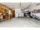 Spacious garage with unfinished walls and ample storage space for vehicles and tools at 2650 S Vaughn Way # B, Aurora, CO 80014