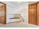 Bright hallway with a cozy built-in bench and natural wood trim at 2650 S Vaughn Way # B, Aurora, CO 80014