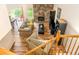 Open-concept living room with stone fireplace, hardwood floors, and natural light at 2650 S Vaughn Way # B, Aurora, CO 80014