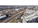 Aerial view showcasing train tracks, station, and residential buildings in the neighborhood at 108 W Byers Pl # G4, Denver, CO 80223