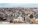 Stunning aerial view of a historic building with a city skyline backdrop and mature trees at 108 W Byers Pl # G4, Denver, CO 80223