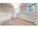 Bright bedroom with carpeting, built-in shelving, and natural light at 108 W Byers Pl # G4, Denver, CO 80223