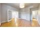 Large bedroom with french doors, hardwood floors, and closet at 108 W Byers Pl # G4, Denver, CO 80223