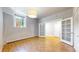Bright bedroom features hardwood floors and ample natural light at 108 W Byers Pl # G4, Denver, CO 80223