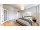 Bedroom with natural light and hardwood floors and closet at 108 W Byers Pl # G4, Denver, CO 80223