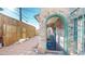 View of the courtyard featuring an archway and a brick patio at 108 W Byers Pl # G4, Denver, CO 80223
