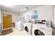 Community laundry room featuring modern, efficient washers and dryers at 108 W Byers Pl # G4, Denver, CO 80223