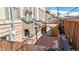 Private patio area enclosed by a wooden fence with brick flooring at 108 W Byers Pl # G4, Denver, CO 80223