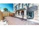 Brick patio with arched brick facade featuring metal window covers at 108 W Byers Pl # G4, Denver, CO 80223