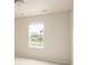 A bedroom with neutral walls and carpet flooring with natural light from a window at 10465 Evansville Cir, Parker, CO 80134