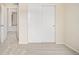 Bedroom featuring closet with sliding doors and entrance to a hallway with another room at 10465 Evansville Cir, Parker, CO 80134