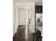 Bright entryway with hardwood floors and access to the kitchen and living areas at 10465 Evansville Cir, Parker, CO 80134