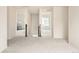 Upstairs hallway featuring neutral walls, carpeted floors, and entries to multiple bedrooms and living spaces at 10465 Evansville Cir, Parker, CO 80134