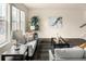 Bright living room with natural light, comfortable seating, and stylish decor at 10465 Evansville Cir, Parker, CO 80134