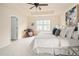 Bright main bedroom with tray ceiling, soft carpet, and ample natural light at 10465 Evansville Cir, Parker, CO 80134