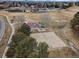 Overhead shot of community park with sports courts, playground, picnic area and green spaces at 10059 Granite Hill Dr, Parker, CO 80134