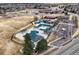 Aerial view showcasing the community pool area and the ample parking available for visitors at 10059 Granite Hill Dr, Parker, CO 80134