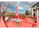 Red painted deck with grill, hammock, table, and swing; perfect for outdoor entertaining at 10059 Granite Hill Dr, Parker, CO 80134