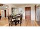 Dining room with wood floors and adjacent rooms at 10059 Granite Hill Dr, Parker, CO 80134