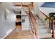 Charming entryway with hardwood floors, staircase, and view of the cozy living room at 10059 Granite Hill Dr, Parker, CO 80134