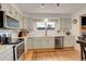 Bright kitchen with stainless steel appliances, stone countertops and natural light at 10059 Granite Hill Dr, Parker, CO 80134