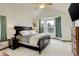 Bright main bedroom with neutral carpet, bay window and ensuite bathroom at 10059 Granite Hill Dr, Parker, CO 80134