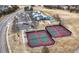 Aerial view of the community's tennis courts, neighborhood pool and playground at 10059 Granite Hill Dr, Parker, CO 80134