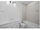 Bathroom showcasing a tiled shower-over-bath and vanity with storage at 2676 W 68Th Ave, Denver, CO 80221