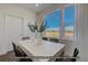 Bright dining area with large windows and seating for six at 2676 W 68Th Ave, Denver, CO 80221