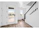 Bright entryway showcasing a stylish front door and staircase at 2676 W 68Th Ave, Denver, CO 80221