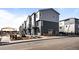 Modern townhome exterior with two-tone siding and a small front yard at 2676 W 68Th Ave, Denver, CO 80221