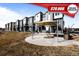 Modern townhomes with open patio and seating area perfect for outdoor entertaining at 2676 W 68Th Ave, Denver, CO 80221