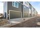 Exterior showcasing multiple garages, each bearing an address at 2676 W 68Th Ave, Denver, CO 80221