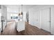 Modern kitchen featuring a central island with pendant lighting and stainless steel appliances at 2676 W 68Th Ave, Denver, CO 80221