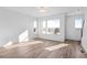 Bright, open living room with wood floors and large windows for natural light at 2676 W 68Th Ave, Denver, CO 80221