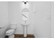 Elegant powder room features a pedestal sink and stylish mirror at 2676 W 68Th Ave, Denver, CO 80221