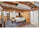 Unfinished basement featuring exposed beams, furniture, and carpeting at 8721 W 86Th Ave, Arvada, CO 80005